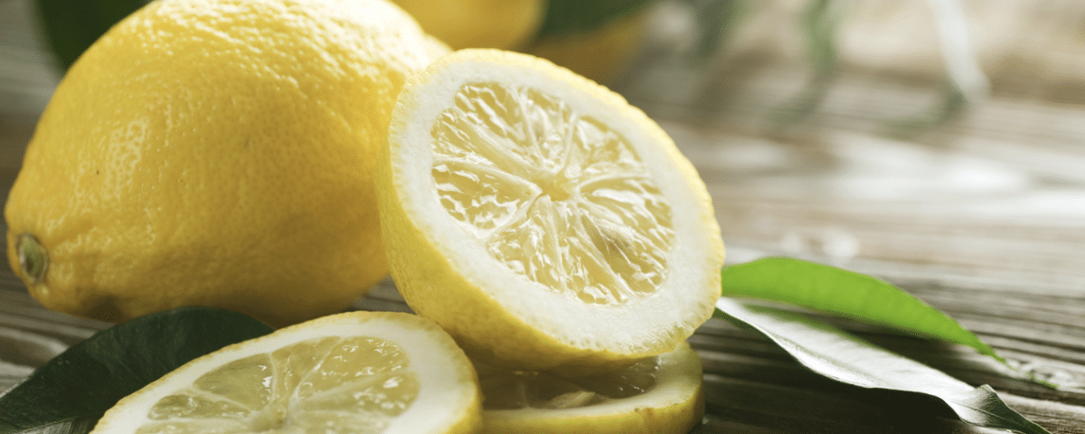 National Lemon Juice Day: lemons, one whole, one sliced