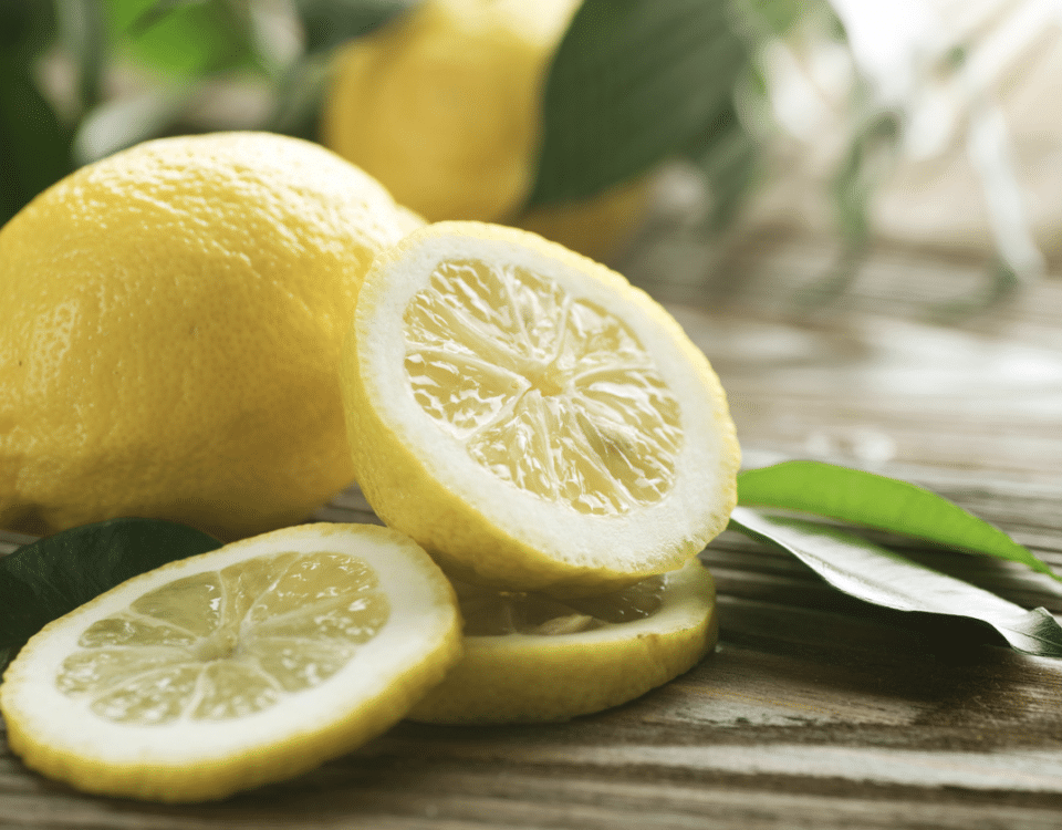 National Lemon Juice Day: lemons, one whole, one sliced