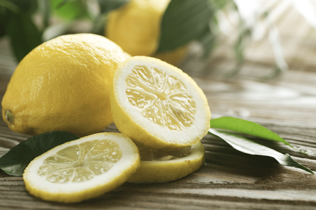 National Lemon Juice Day: lemons, one whole, one sliced